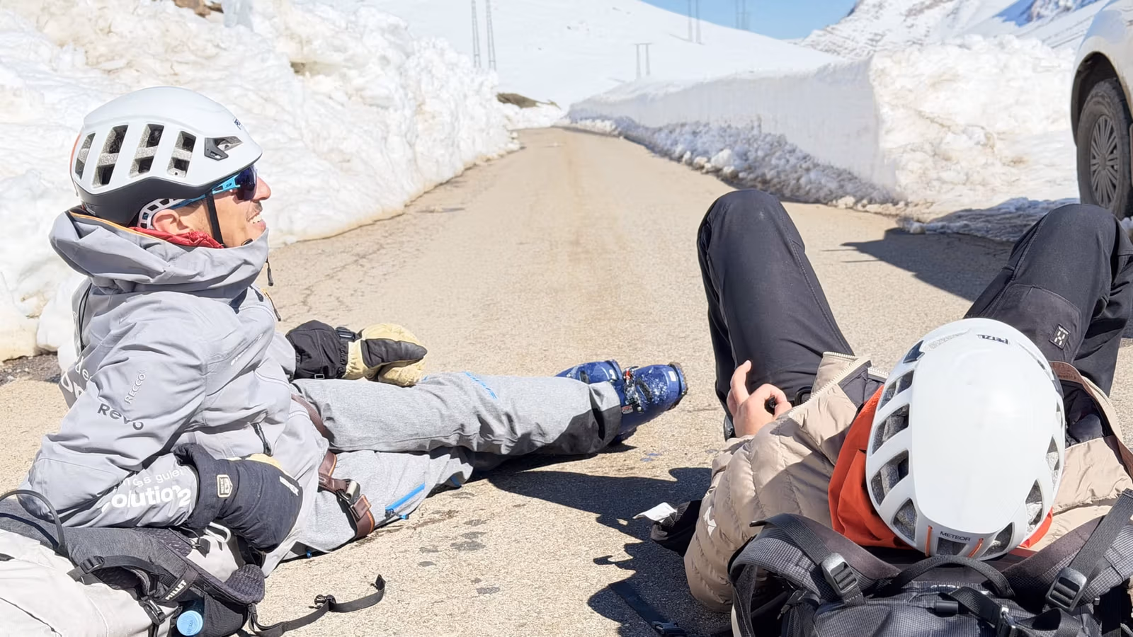 Skiers resting on snow
